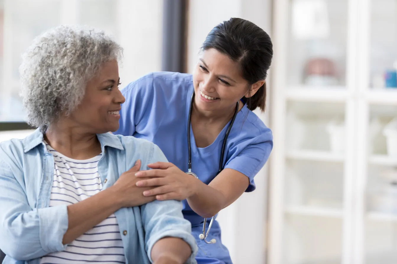 A nurse caring for an older patient