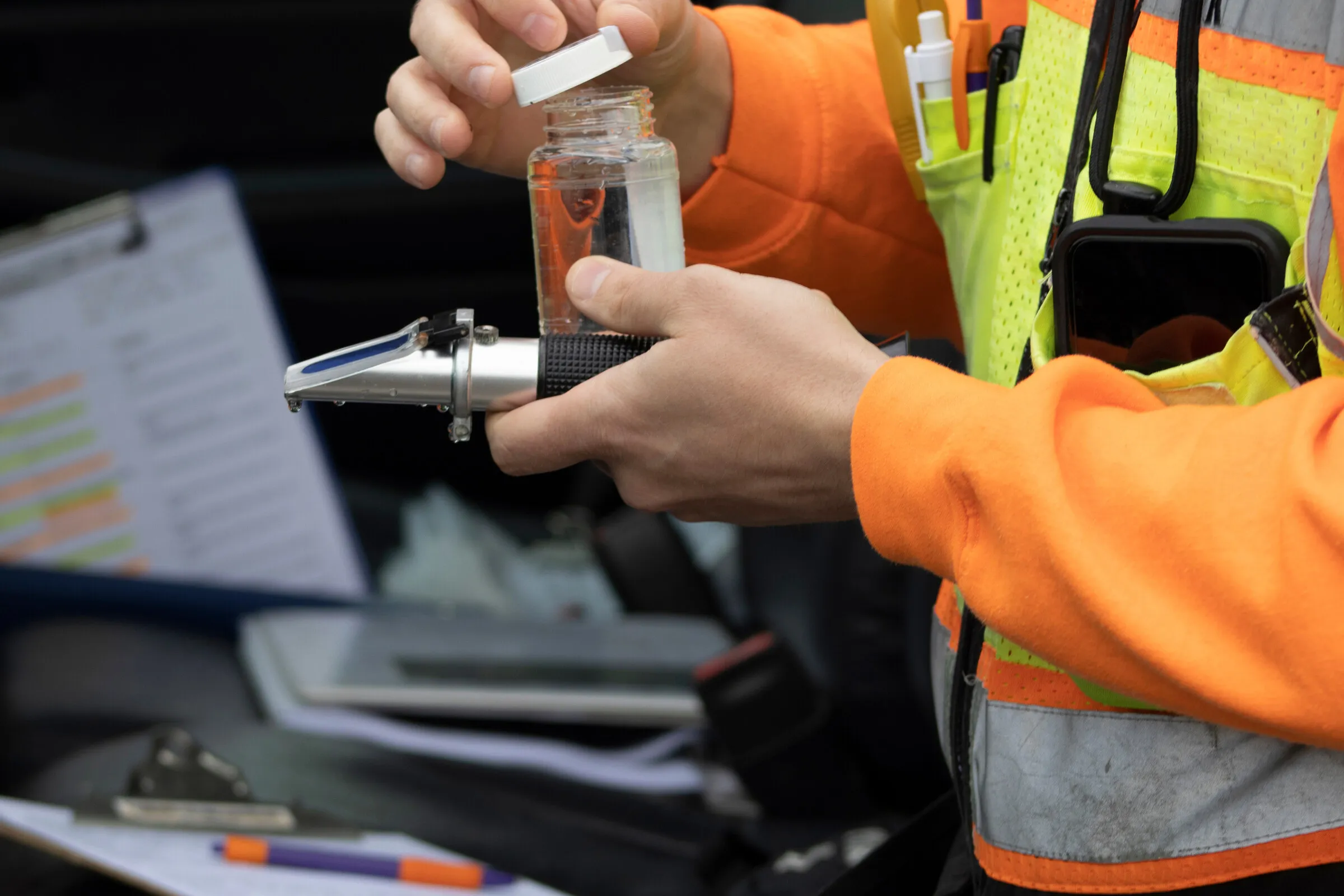 Field technician collecting a water sample